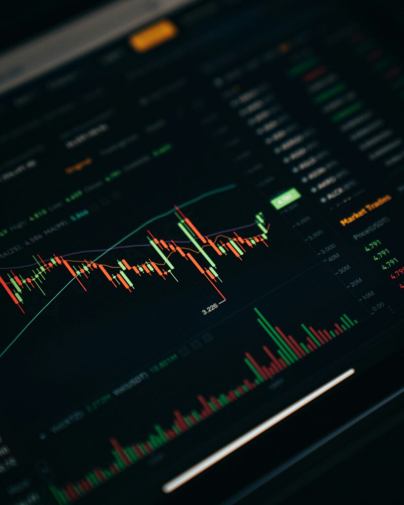 Crypto trader workstation with market charts from Unsplash